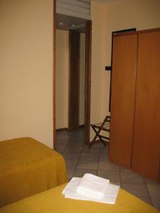 Postel nebo postele na pokoji v ubytování Albergo Paradiso