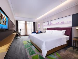 Ένα ή περισσότερα κρεβάτια σε δωμάτιο στο Hampton by Hilton Guangzhou Dongxiaonan