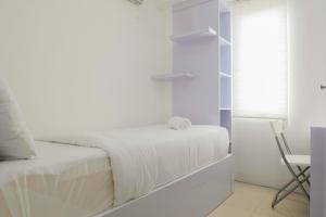 Ένα ή περισσότερα κρεβάτια σε δωμάτιο στο Spacious and Clean 3BR Bassura City Apartment By Travelio +18 φωτογραφίες