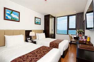 Postel nebo postele na pokoji v ubytování Golden Line Hotel Danang + 37 fotografií