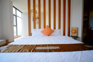 Postel nebo postele na pokoji v ubytování Chiu Chunt Dint B&B