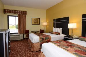 a hotel room with two beds and a television at SureStay Hotel by Best Western Robinsonville Tunica in Tunica Resorts