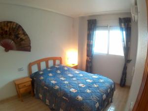 Postel nebo postele na pokoji v ubytování Apartment Vistamar10 + 9 fotografií