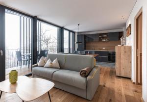 a living room with a couch and a table at naturApart in Brunico