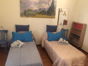 מיטה או מיטות בחדר ב-A casa di Elena