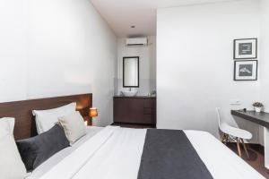Postel nebo postele na pokoji v ubytování Kak Garden Inn