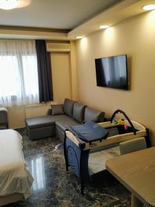 A television and/or entertainment centre at Agias Sofias Street Luxurious Studio