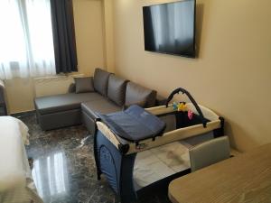 A television and/or entertainment centre at Agias Sofias Street Luxurious Studio