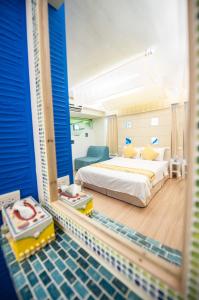 Postel nebo postele na pokoji v ubytování Indigo Homestay + 15 fotografií