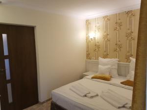 Llit o llits en una habitació de Grand Hotel Minerva Resort & SPA