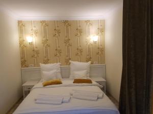 Postel nebo postele na pokoji v ubytování Grand Hotel Minerva Resort & SPA