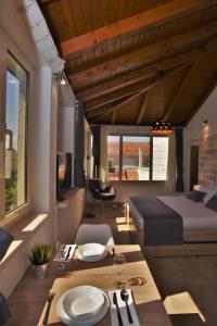 a room with a bed and a table with plates on it at APARTMENTS4YOU SUPETAR-the BEST and MOST POPULAR apartments for DISCOVERING the island - free parking - 200 meters from the beach in Supetar