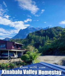 a house with a view of a mountain at Kinabalu Valley Guesthouse in Kundasang