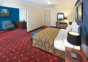 Voodi või voodid majutusasutuse Ani Plaza Hotel toas