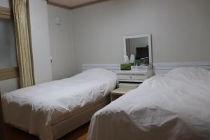 Postel nebo postele na pokoji v ubytování Orasung Motel