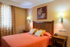 Postel nebo postele na pokoji v ubytování Aparthotel El Galeón