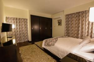 Voodi või voodid majutusasutuse Royal Maadi Hotel toas