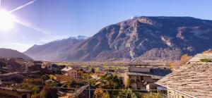 a village with a mountain in the background at Casa la foriana in Carema