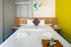 Postel nebo postele na pokoji v ubytování Ibis Styles Lviv Center