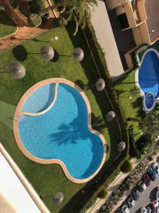 an overhead view of a swimming pool in a yard at Parc Loix apartment in Benidorm