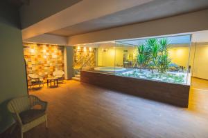 a room with a large aquarium in the middle of it at Star inn Peniche in Peniche
