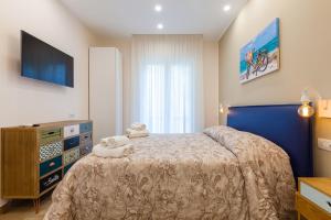 Posteľ alebo postele v izbe v ubytovaní Sorrento Sweet Sirena 1