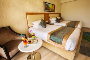 Pickalbatros Aqua Blu Sharm El Sheikh客房内的一张或多张床位