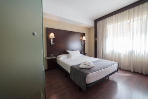 Postel nebo postele na pokoji v ubytování Hotel Salymar