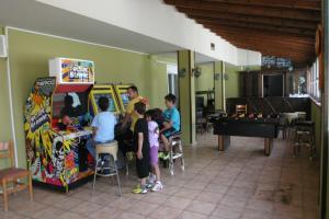 a group of people playing a game in a room at Ducata Hotel - Xirolivado in Xirolívadon