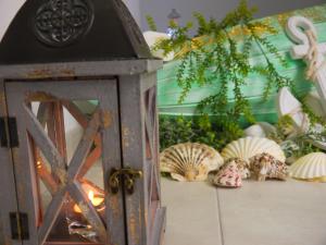 a room with shells on the floor next to a door at Hotel Maravillas del Mundo in Calpe