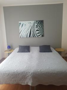 Ένα ή περισσότερα κρεβάτια σε δωμάτιο στο Homestay Dodo