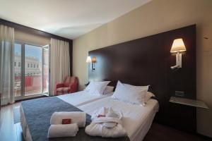 Postel nebo postele na pokoji v ubytování Hotel Salymar + 37 fotografií
