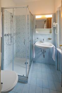 a bathroom with a shower and a sink at Hotel Antico in Intragna +144 photos