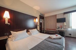 Postel nebo postele na pokoji v ubytování Hotel Salymar