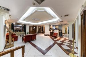 a living room with a coffered ceiling and a living room at Vergina Hotel in Thessaloniki