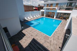 a swimming pool on the roof of a building at Cumbaza Hotel & Convenciones in Tarapoto