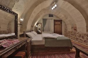 Postel nebo postele na pokoji v ubytování Yoruk Stone House