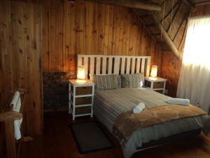 Postel nebo postele na pokoji v ubytování Myoli Beach Lodge