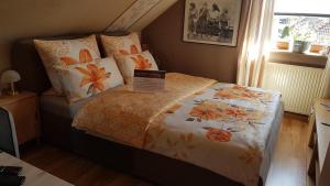 Llit o llits en una habitació de Pension Bütterich