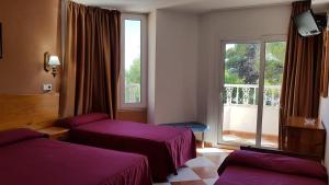 Postel nebo postele na pokoji v ubytování Hotel Cabo de Mar