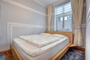 Ένα ή περισσότερα κρεβάτια σε δωμάτιο στο Waldhaus Gertrud - 120 m zum Strand