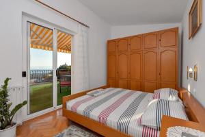Postel nebo postele na pokoji v ubytování Apartment Gojak Mišo Alen