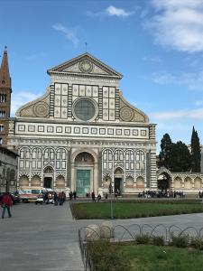 a large building with a clock on top of it at B&B Kingsman in Florence