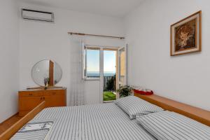 Postel nebo postele na pokoji v ubytování Apartment Gojak Mišo Alen