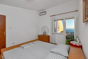 Postel nebo postele na pokoji v ubytování Apartment Gojak Mišo Alen