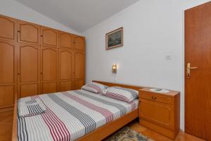 Postel nebo postele na pokoji v ubytování Apartment Gojak Mišo Alen