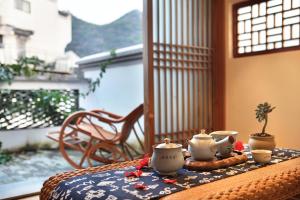 Ein Balkon oder eine Terrasse in der Unterkunft The Beyond Villa Guilin Boutique Hotel