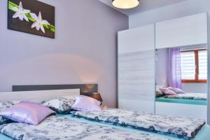 Posteľ alebo postele v izbe v ubytovaní Apartment Klaudio