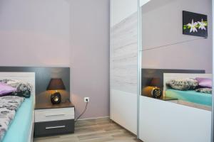 Posteľ alebo postele v izbe v ubytovaní Apartment Klaudio