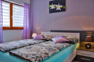 Posteľ alebo postele v izbe v ubytovaní Apartment Klaudio